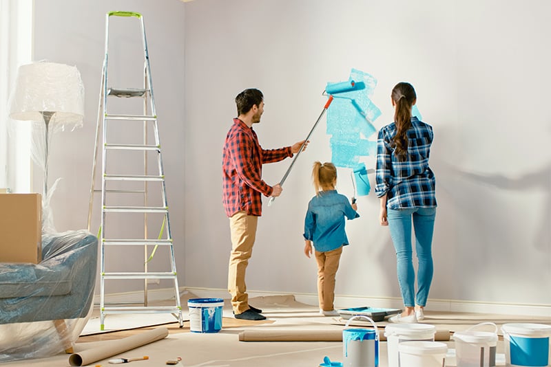 Family painting their home and doing a dyi project.